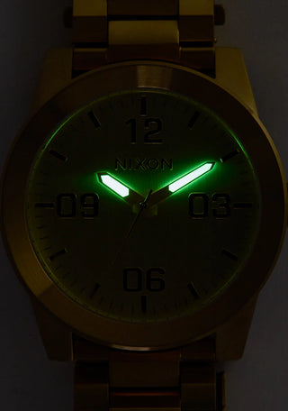 Nixon Corporal Chocolate/Dark Roast analog watch with stainless steel bracelet and rugged brown field-style dial.