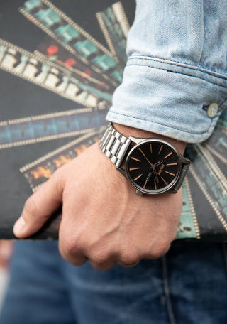 Nixon Sentry Blue Sunray analog watch with stainless steel bracelet and textured blue sunray dial.