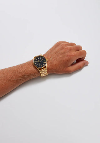 Image of the Nixon Sentry Stainless Steel Gold/Black watch, showcasing its gold design and stainless steel bracelet.