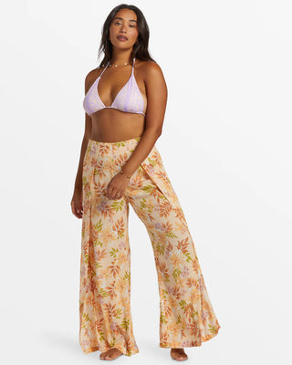 Peach Whip floral print wide-leg pants with high front slits and elastic back waistband.