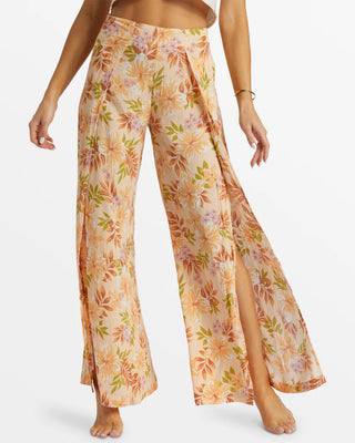 Peach Whip floral print wide-leg pants with high front slits and elastic back waistband.