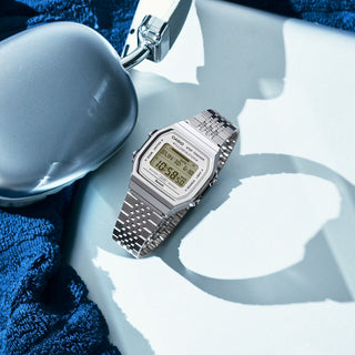 Casio Vintage ABL-100WE-7A Watch in White/Gold — classic digital display, resin case and band, LED backlight, water resistant, with auto calendar and daily alarm