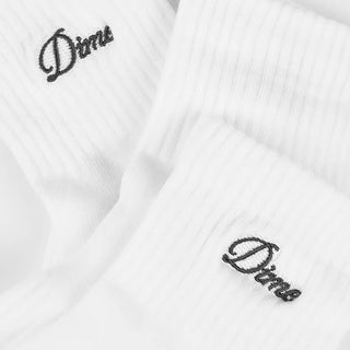 Dime short socks in White with a black embroidered script logo near the cuff
