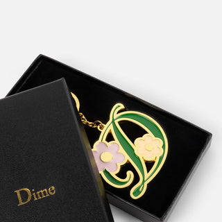 Dime Oversized Floral Keychain in Gold — zinc alloy with enamel fill and branded 32mm keyring, oversized floral design