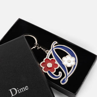 Dime Oversized Floral Keychain in Silver — zinc alloy with enamel fill and branded 32mm keyring, oversized floral design
