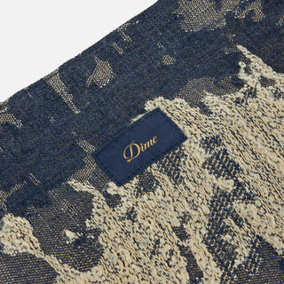 Military camo Dime distressed messenger bag with adjustable cross-body strap.