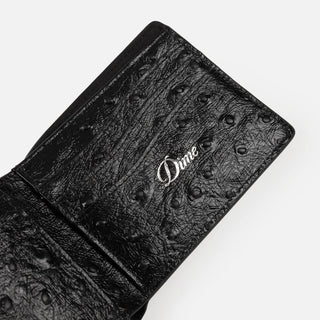 Black Dime wallet with textured finish and subtle logo detail