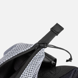 Close-up of a black strap with a buckle on a white background