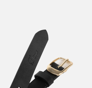 Black leather watch strap with gold buckle on a white background
