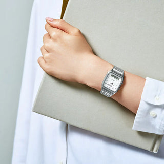 Casio Vintage AQ230A-7DMQY watch with silver bracelet, analog-digital display, and classic rectangular case.