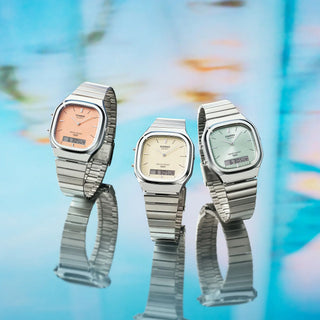 Casio Vintage AQ240E-7A2 watch with silver bracelet, white matte dial, and analog-digital display.