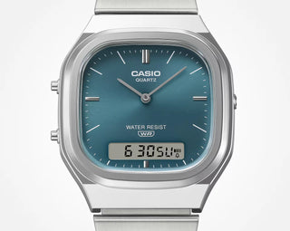 Casio watch with blue face and digital display on a white background