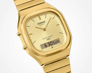 Gold Casio watch with digital display on a white background