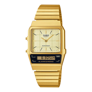 Gold Casio watch with digital and analog display on a white background