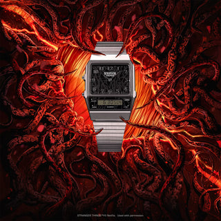 G-Shock watch with 'Stranger Things' branding in a fiery dragon design