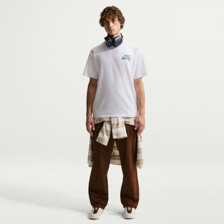 White Nike SB skate t-shirt with classic chest logo, loose fit silhouette, and ribbed crew neckline.