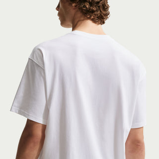 White Nike SB skate t-shirt with classic chest logo, loose fit silhouette, and ribbed crew neckline.