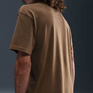 Nike SB Logo Skate Tee Mosswood Brown with soft jersey fabric, loose fit design, ribbed neck, and classic chest logo.