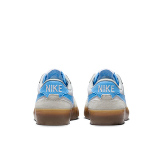 Nike SB Women's Pogo Plus in Summit White/University Blue-White, with canvas and leather upper and Zoom Air cushioning.