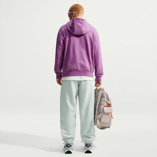 Nike ACG Tuff Fleece pullover hoodie in Monarch Purple with a white chest logo, adjustable hood cords, and a kangaroo pocket.