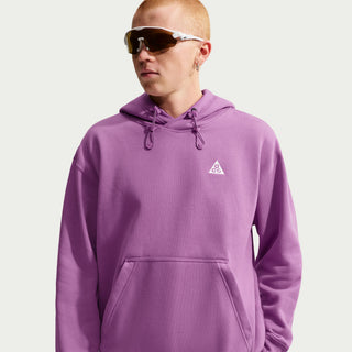 Nike ACG Tuff Fleece pullover hoodie in Monarch Purple with a white chest logo, adjustable hood cords, and a kangaroo pocket.