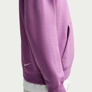 Nike ACG Tuff Fleece pullover hoodie in Monarch Purple with a white chest logo, adjustable hood cords, and a kangaroo pocket.