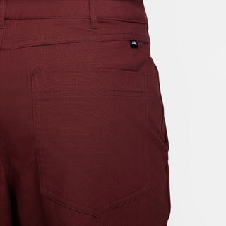 Nike SB Double Knee Skate Pants in Dark Team Red, durable with reinforced knees and six pockets.