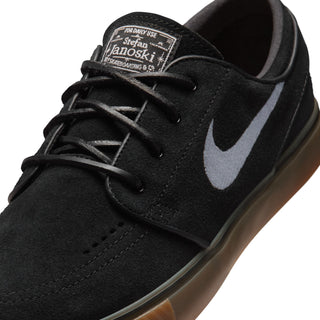 Nike SB Zoom Janoski OG+ skate shoes in Black, White, and Gum colorway with suede upper and vulcanized sole
