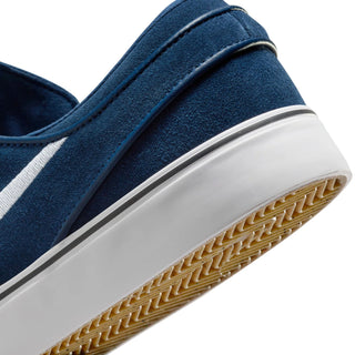 Nike SB Zoom Janoski OG+ in Navy/White with suede upper, Zoom Air cushioning, and skate-specific tread.