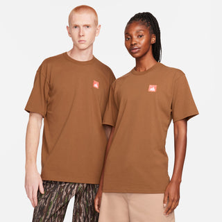 Nike SB Skate Tee in Light British Tan with embroidered patch, 100% organic cotton, ribbed collar.