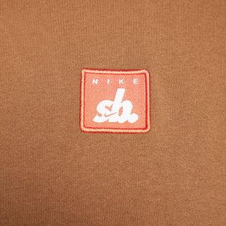 Nike SB Skate Tee in Light British Tan with embroidered patch, 100% organic cotton, ribbed collar.