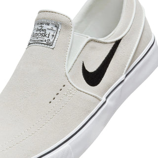 Nike SB Janoski+ Slip skate shoes in Summit White/Black with suede upper and Zoom Air cushioning.