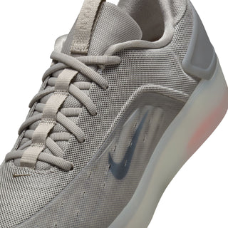 Nike SB Zoom Nyjah 4 in college grey and mink brown with reinforced mesh, Zoom Air cushioning, and HART outsole.