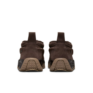 Nike ACG Izy in Baroque Brown/Sanddrift Velvet with moccasin-inspired styling, contrast stitching, zipper closure, and a rugged rubber outsole.