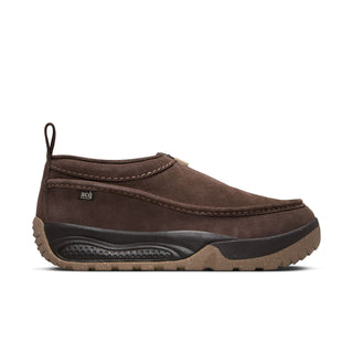 Nike ACG Izy in Baroque Brown/Sanddrift Velvet with moccasin-inspired styling, contrast stitching, zipper closure, and a rugged rubber outsole.