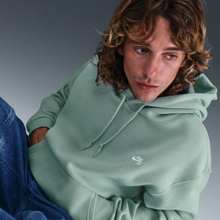 Nike SB Cannon White fleece skate hoodie, brushed midweight fleece, roomy fit, embroidered chest logo, cotton polyester blend.