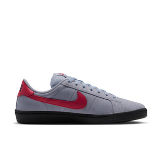 Medial side view of Nike SB Tennis Classic featuring grey suede upper, red Nike Swoosh and black rubber sole.