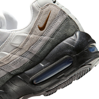 Nike Air Max 95 sneakers in Black and Cacao Wow colorway with layered mixed materials and visible Max Air cushioning