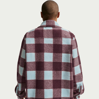 Glacier blue Nike SB skate shirt jacket with burgundy accents, oversized fit, dropped shoulders, and embroidered chest logo.