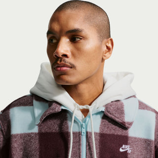 Glacier blue Nike SB skate shirt jacket with burgundy accents, oversized fit, dropped shoulders, and embroidered chest logo.