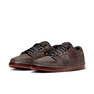 Nike SB Dunk Low Pro Premium Krampus in crackled grey leather with orange underlays.