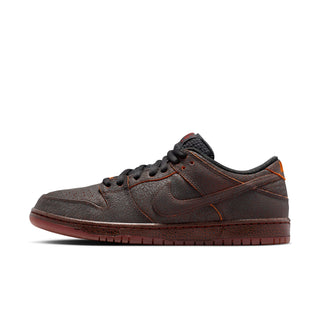 Nike SB Dunk Low Pro Premium Krampus in crackled grey leather with orange underlays.