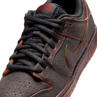 Nike SB Dunk Low Pro Premium Krampus in crackled grey leather with orange underlays.