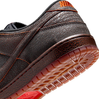 Nike SB Dunk Low Pro Premium Krampus in crackled grey leather with orange underlays.