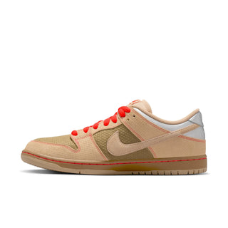 Beige sneaker with red accents on a white background