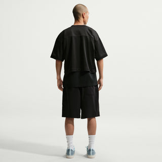Nike SB Skate Shorts in Black/White — sweat-wicking nylon-spandex blend with roomy skate fit, elastic canvas belt waistband, and hook-and-loop back pockets.

