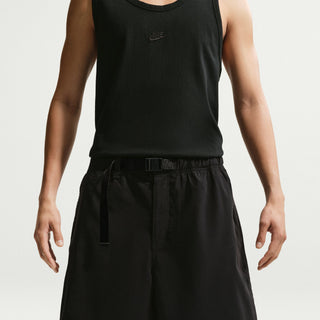 Nike SB Skate Shorts in Black/White — sweat-wicking nylon-spandex blend with roomy skate fit, elastic canvas belt waistband, and hook-and-loop back pockets.

