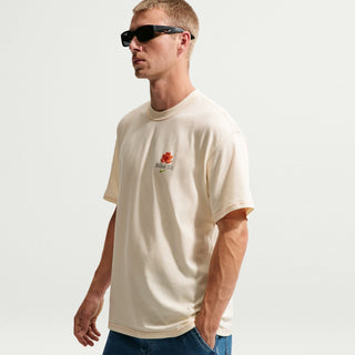 Nike SB Som Tum Skate Tee in Coconut Milk, midweight 100% cotton with dropped shoulders, loose fit, and embroidered flower graphic on front
