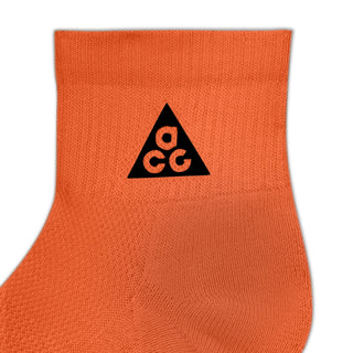 Nike ACG Everyday Elevated Ankle Socks in Safety Orange, Black, and Reflective — shown as a single pair with cushioned heel and mesh top detail