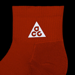 Nike ACG Everyday Elevated Ankle Socks in Safety Orange, Black, and Reflective — shown as a single pair with cushioned heel and mesh top detail